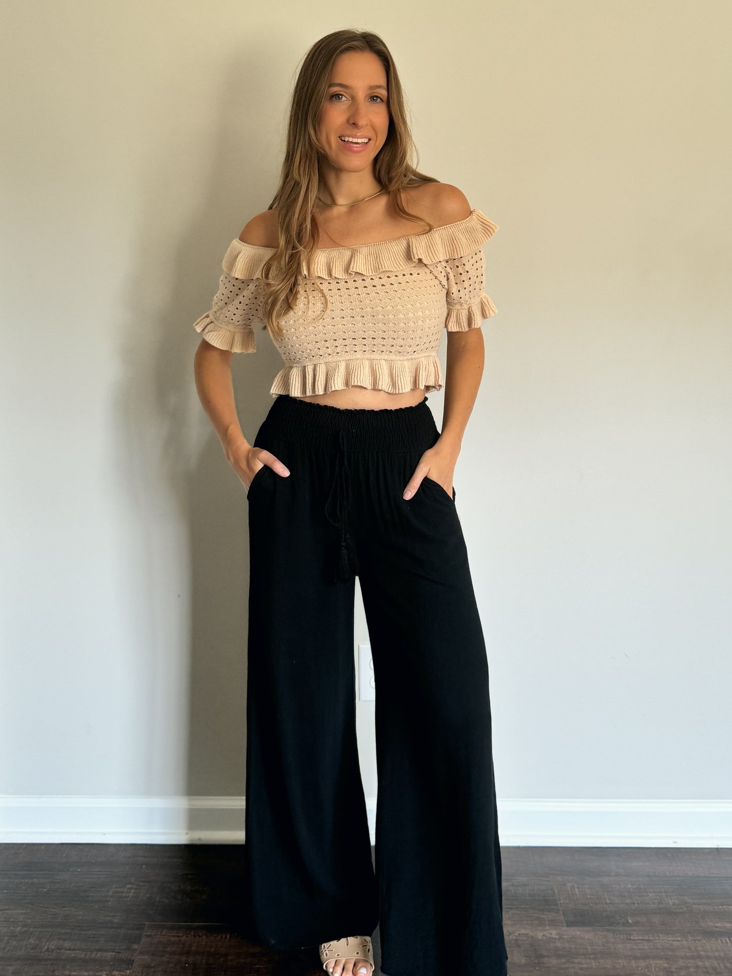 ruffled off shoulder knit top with black linen pants