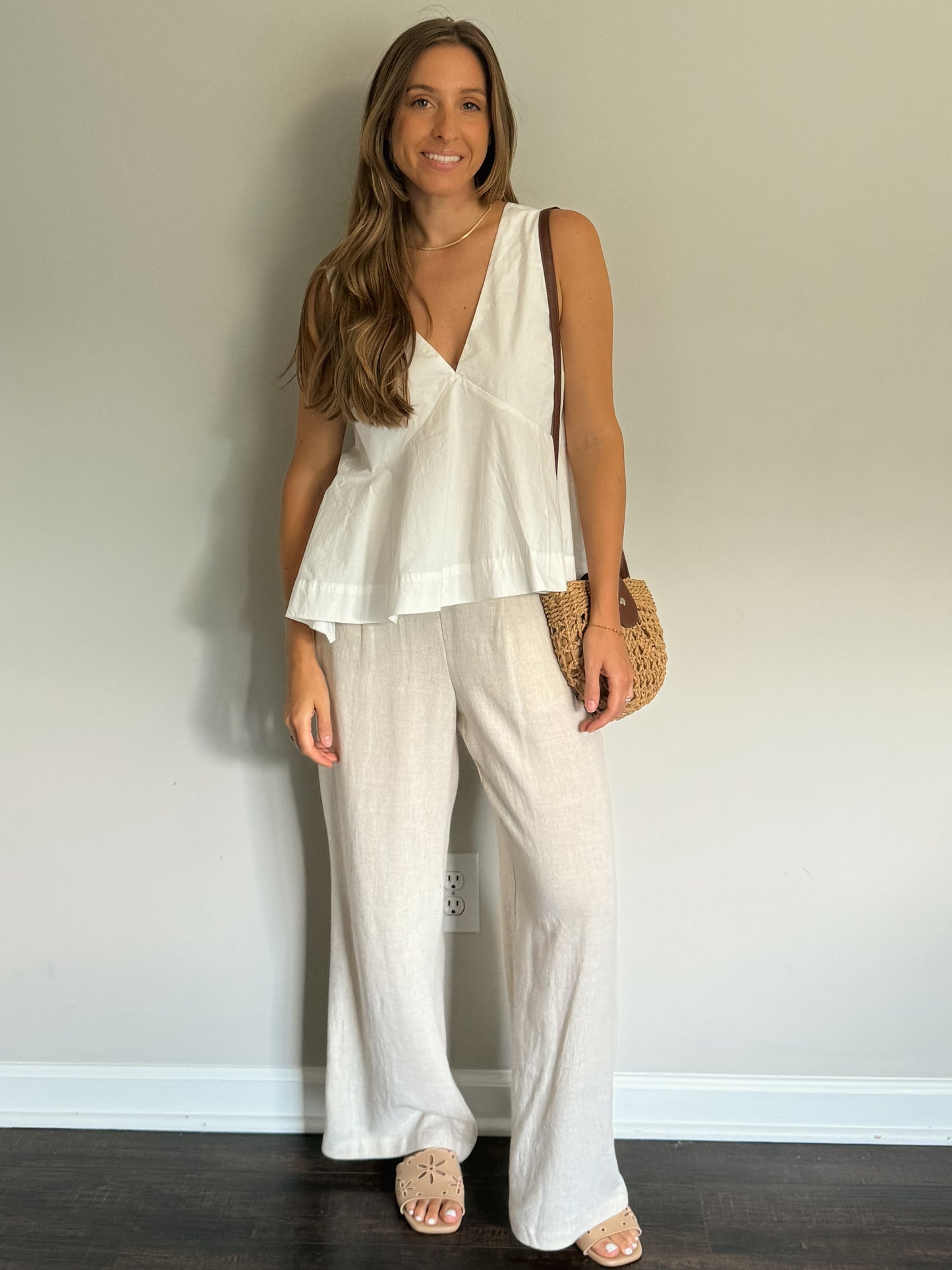white v-neck flare out top with linen pants